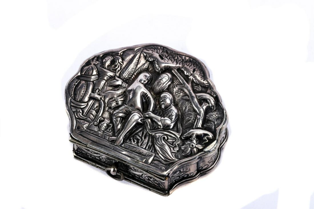 (18th/19th c) DUTCH / CONTINENTAL SILVER BOX: Scalloped edged box with hinged cover, hand chased in bas relief with hunting and boudoir scenes. unmarked. 3/4 x 2 3/8 x 2 7/8 inches. 3.17 trou ounces