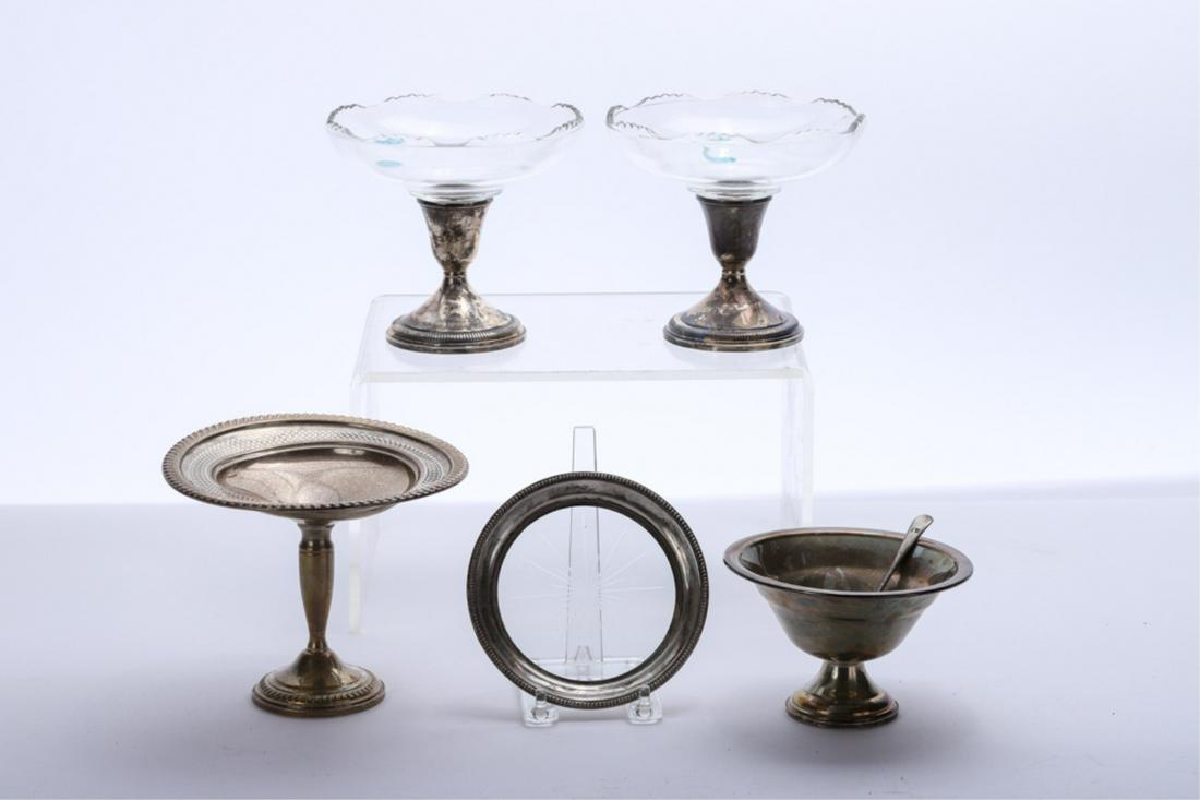 (5) PIECES OF WEIGHTED STERLING SILVER: Including: (4) Compotes and (1) coaster. Together with a silver plated spoon. 5 1/2 inches (and under)