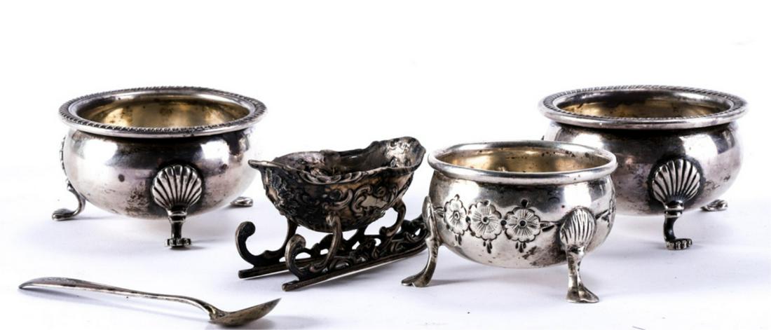 (4) STERLING SILVER OPEN MASTER SALTS etc: Pair of Fisher sterling silver salts with gadrooned rims, scallop shell feet, hand chased example by Baldwin and Miller, an unmarked rococo example and a Gorham spoon. 6.9 troy ounces.
