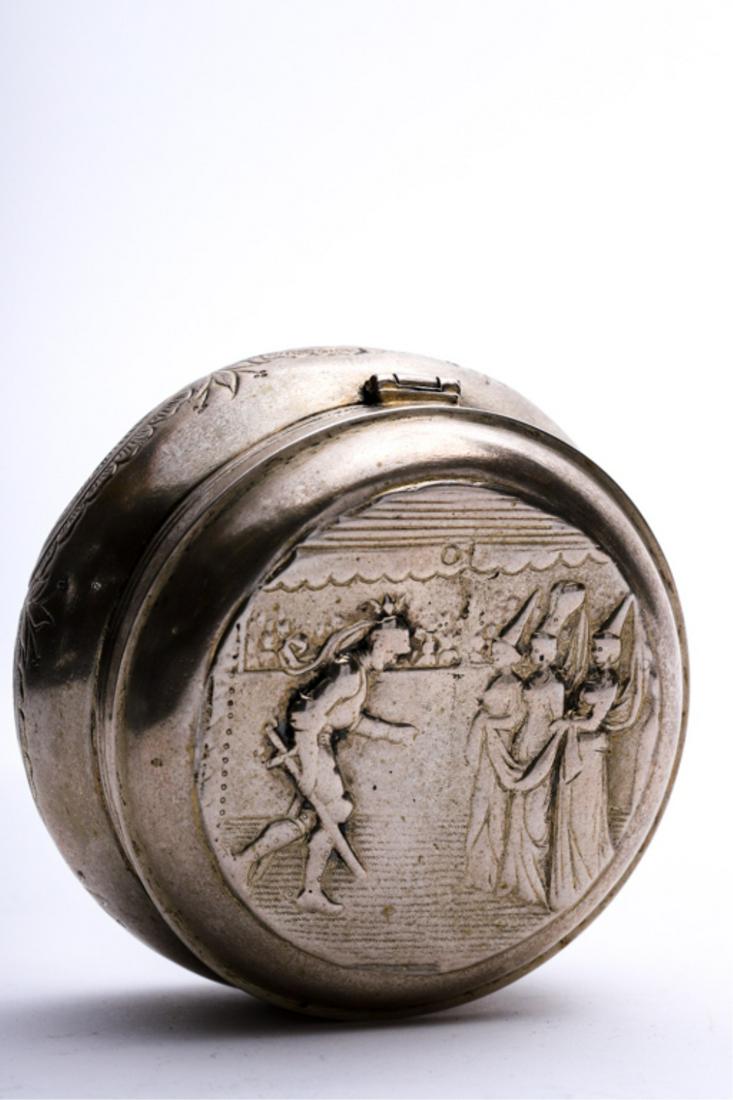 DUTCH STERLING SILVER DRESSER BOX: Hinged cover embossed with knight bowing to damsels. Gold washed font embossed with scallops and acanthus leaves. hallmarked. 2 1/4 x 4 inches. 6.31 troy ounces.