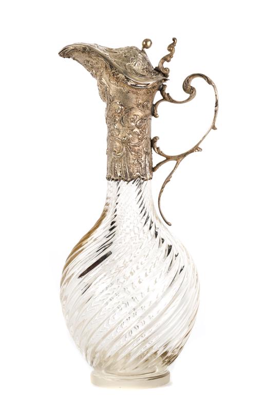 CRYSTAL EWER with SILVER MOUNTED HANDLE & SPOUT: Twisted crystal font with rococo embossed neck and figural spout. unmarked. 11 inches.