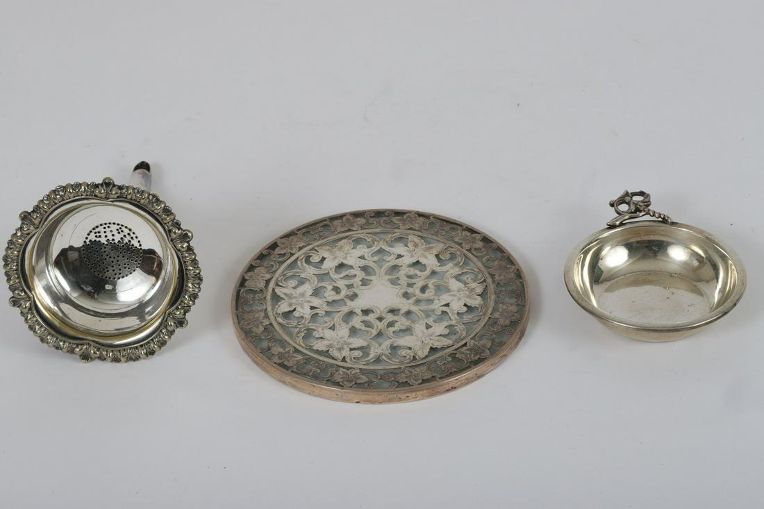 SILVER OVERLAY STERLING TRIVET, TRAY & FUNNEL: Silver plated 6 ½ inch funnel unmarked. Trivet measures 6 inches. Sterling silver tray with floral handle weighs 2.91 troy ounces.