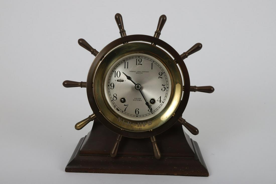 CHELSEA SHIP'S BELL SHELF CLOCK: Retailed by Thomas Long Company, Boston. #642348. 3 ½ inch dial. 9 inches diameter overall. Together with key, hands stop and owners manual.