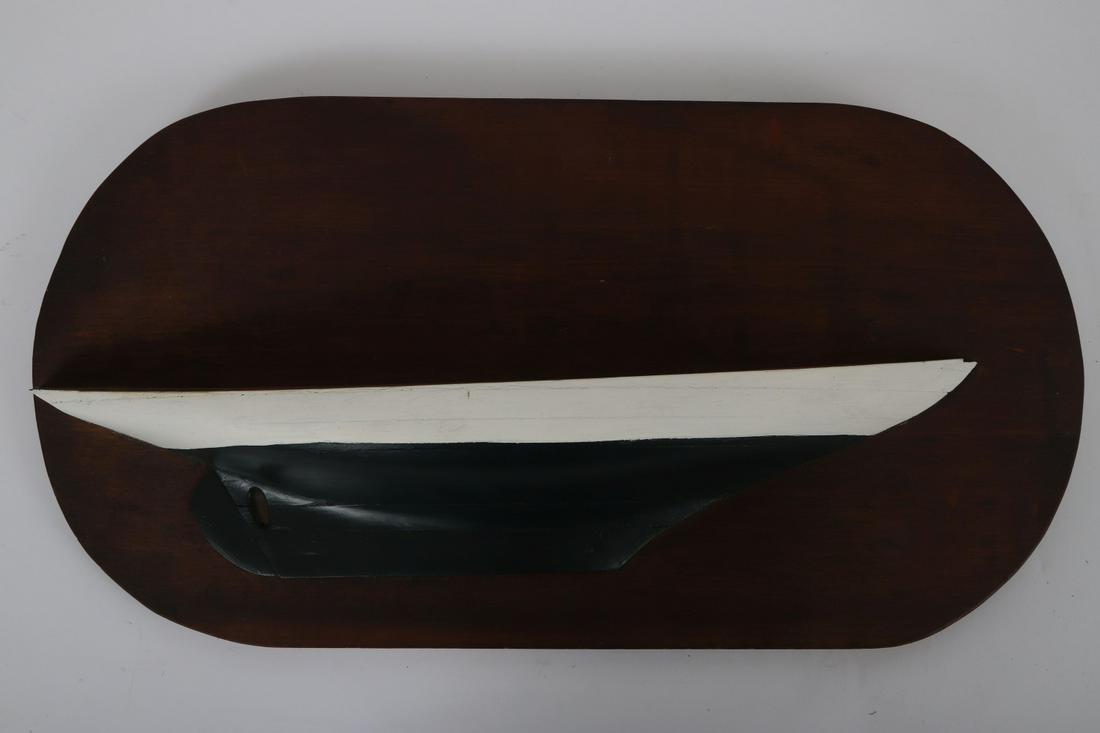 MABLEHEAD HALF MODEL of a SAILBOAT HULL: Carved and painted wood. Unsigned. 11 3/8 x 21 5/8 inches. Note: Model was made by naval architect and yacht designer Samuel H. Brown Jr. whose career included work with LF Herreshoff and John Alden.