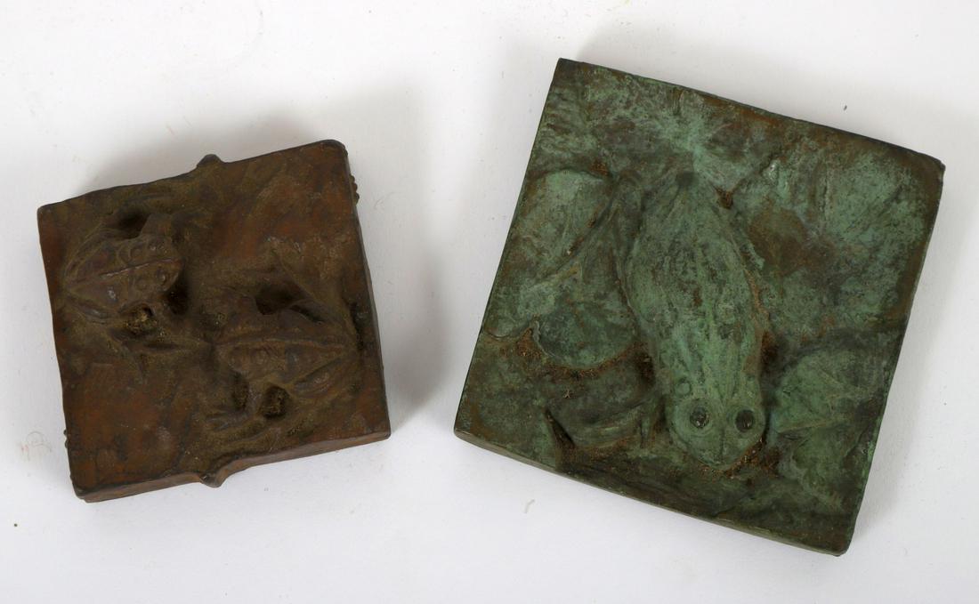 (2) BRONZE TILES CAST with FROGS: (1) Embossed “M” 1953 and signed H.P.M. 3 ½ x 3 ½ inches and 2 ½ x 2 ½ inches signed “Hi”. Note: The artist is Dr. Harris Mosher, head of Mass Eye & Ear Institute in Boston. His art was fr