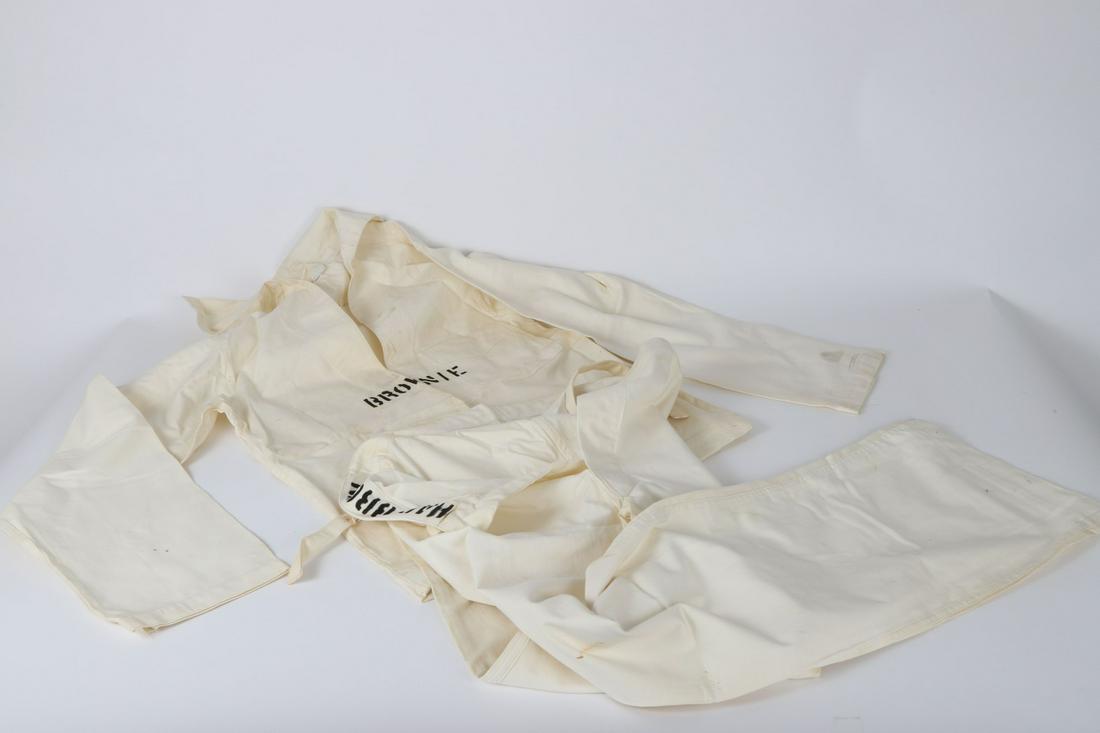 WWI NRA SAILOR'S UNIFORM / US NAVAL ACADEMY: Long sleeve, v-neck, pull over top with single breast pocket and back flap. Button fly bell bottomed pants. Sized 6 and stenciled Brownie