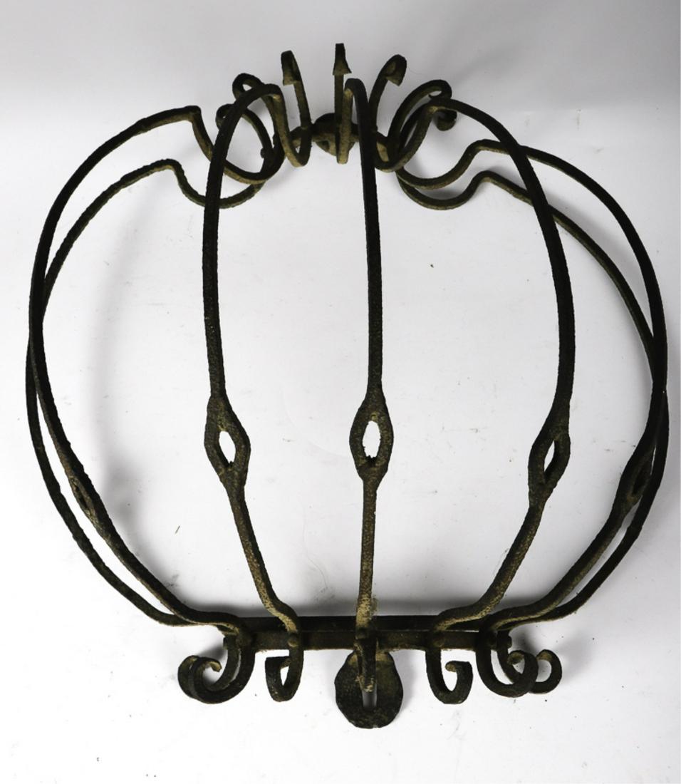 ORNATE ANTIQUE WROUGHT IRON FEEDER: 18 x 17 1/2 x 9 inches.