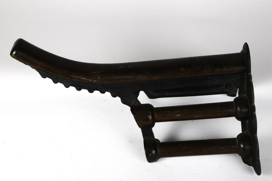 CAST IRON AND WOODEN SADDLE BRACKET RACK: J.L. Mott Iron Works. 10 x 14 x 20 inches.