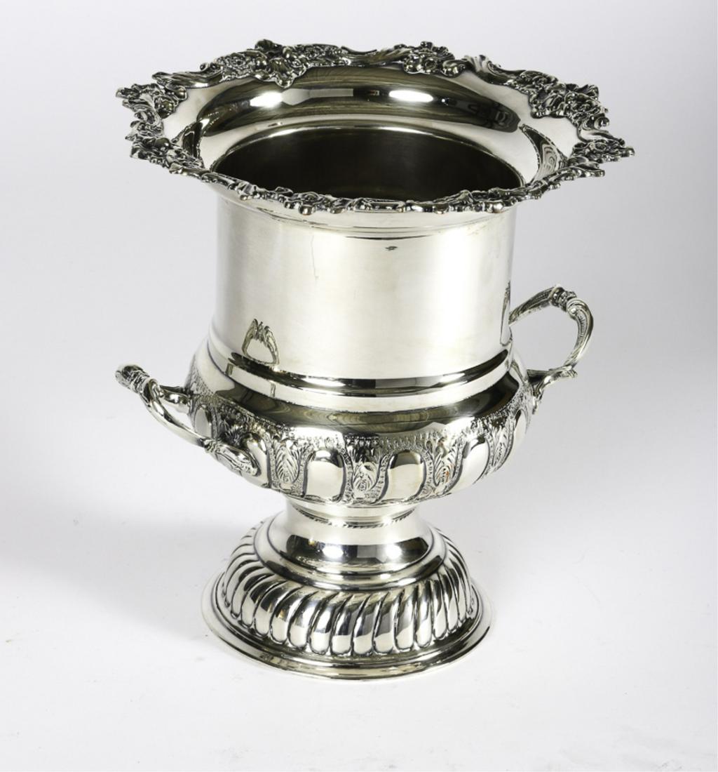 ISRAEL FREEMAN & SON PRESENTATION TROPHY: English hand chased two handled champagne bucket cast with acanthus leaf and shell rim. 10 inches.