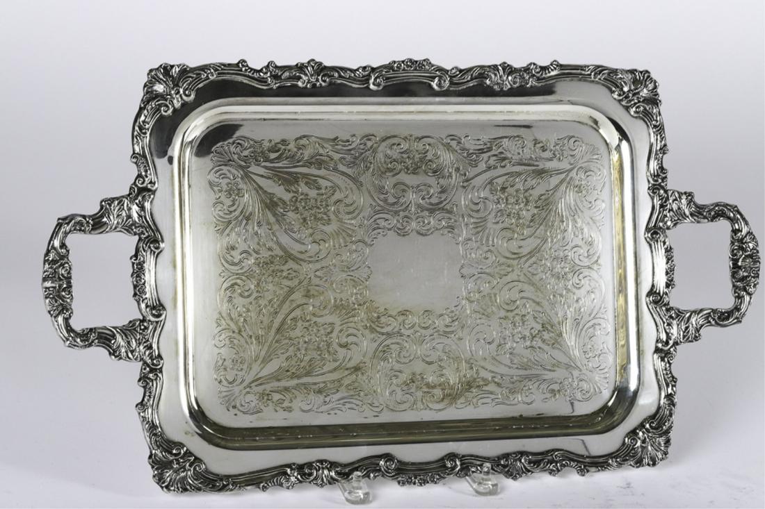 SHERIDAN SILVER PLATED PRESENTATION TRAY: Heavily cast (2) handled tray with rococo rim and handles. Tray embossed with scrolls and floral patterns. 13 x 23 inches. From the Trophy Case of William Haughton.