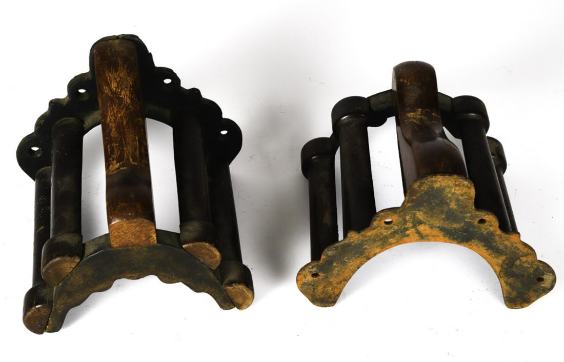 (2) CAST IRON AND WOODEN BRIDLE BRACKETS: 7 x 7 x 8 inches (and smaller). Provenance: W.R. Haughton Stables
