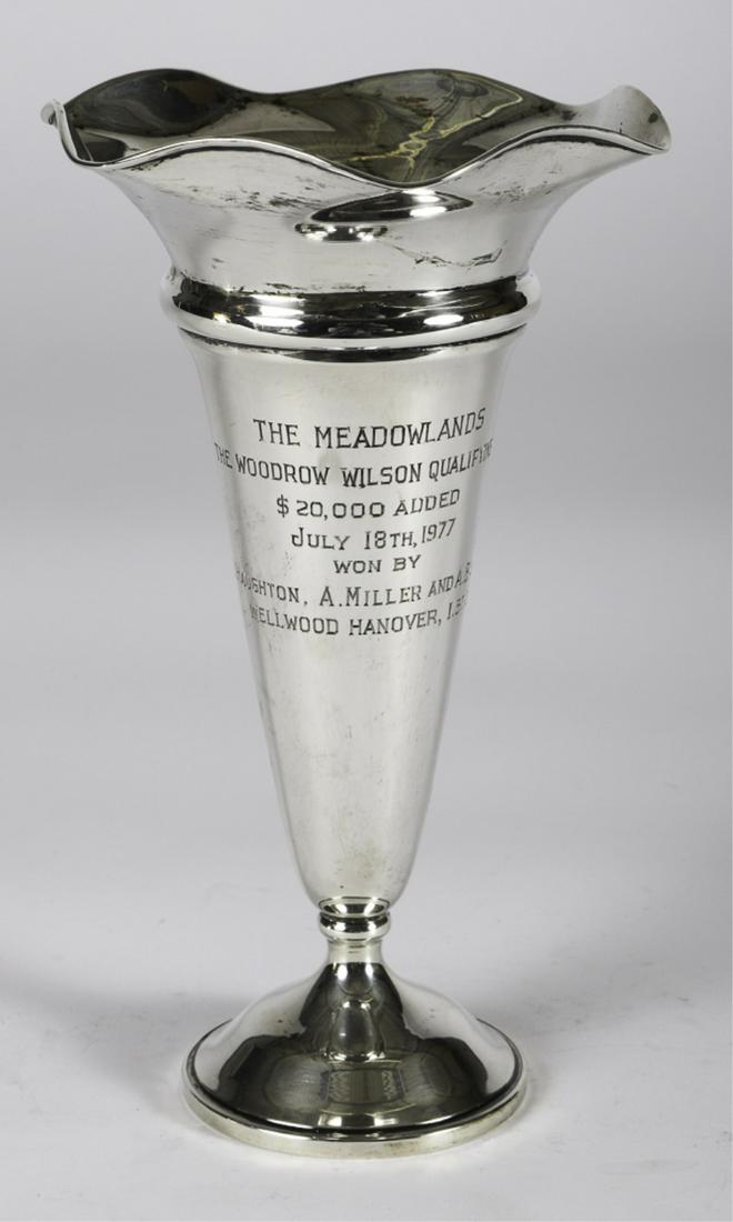 1977 MEADOWLANDS WOODROW WILSON QUALIFYING DASH: $20,000 Added. July 18th, 1977. Won by H. Haughton, A. Miller and A. Bachner. Wellwood Hanover 1.57.2. Sterling silver presentation trumpet vase by Baldwin and Miller. 8 1/2 inches. weighted. 10 inche