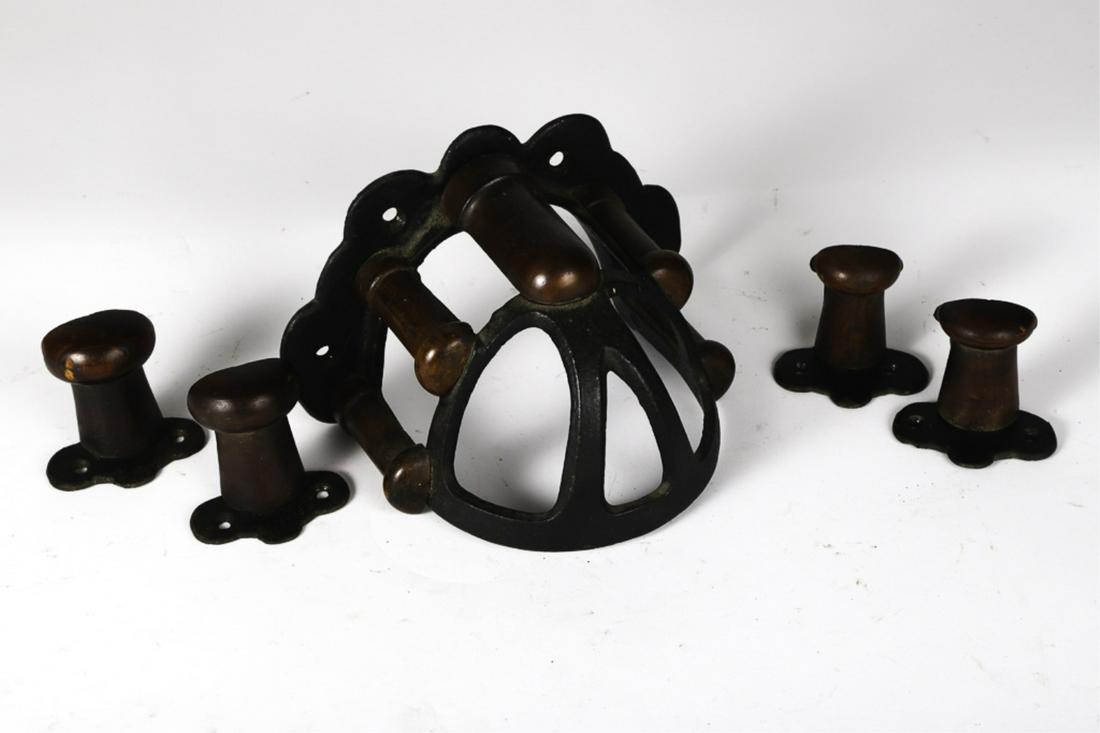 (5) CAST IRON AND WOODEN BRIDLE BRACKETS: 6 1/2 x 9 1/2 x 5 inches (and smaller). Provenance: W.R. Haughton Stables