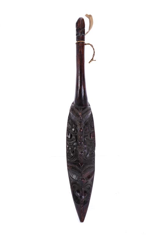 (Late 19th c) PACIFIC ISLANDS MAORI EDGED WEAPON: Carved with heads of various deities and geometric designs. 26 inches