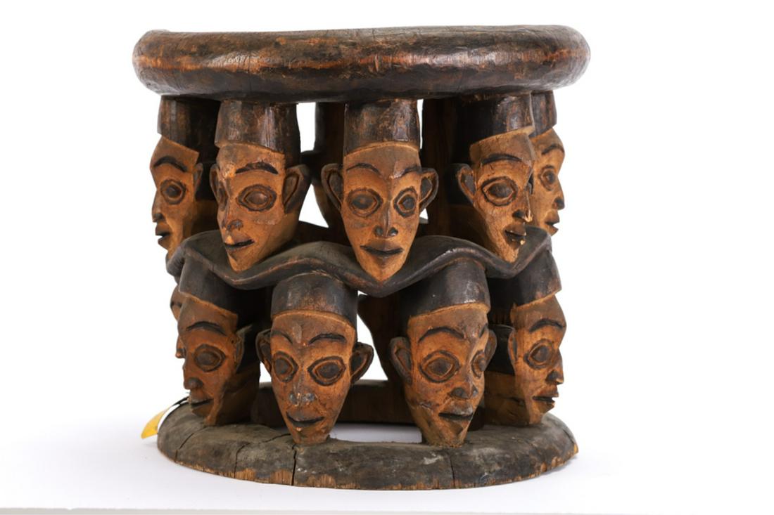 BAULE CHEIFTAN STOOL carved w/ ROWS OF HUMAN HEADS: (c1950 or earlier) Carved and painted wood. 12 1/2 x 13 inches.