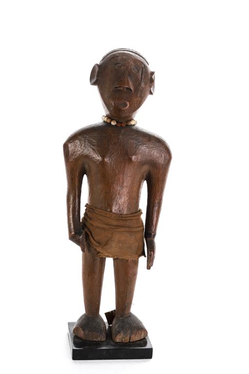 SOUTH AFRICAN HARDWOOD FIGURE OF STANDING WOMAN: (Early 20th c) Wearing a cloth loin cloth. Carved from a very dense blond-ish wood and wearing a necklace made of plant seeds. 21 inches
