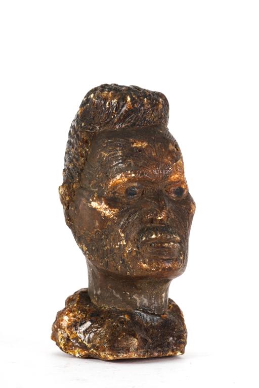 KAURI GUM BUST of a NEW ZEALAND MAORI NATIVE: Figure sculpted from gum with tattooed face. 4 1/4 inches.