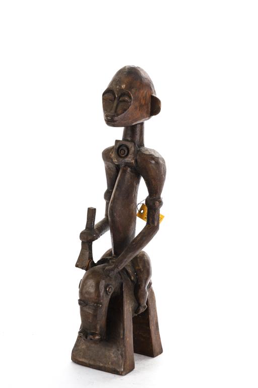 WEST AFRICAN EQUESTRIAN FIGURE of CHEFTAN: Holding a musket and wearing an a gorget. 19 inches.