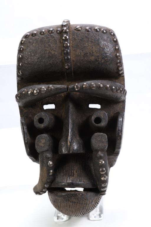 AFRICAN NYABWA MASK BETE TRIBE IVORY COAST: Carved wood highlighted with brass tacks. 11 x 7 x 5 inches.