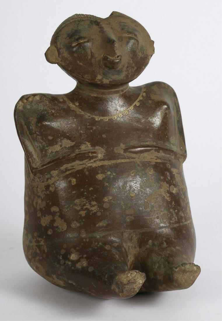 A COLIMA PAINTED REDWARE FIGURE OF A SEATED FEMALE: Painted necklace and nose ring. 11 inches.