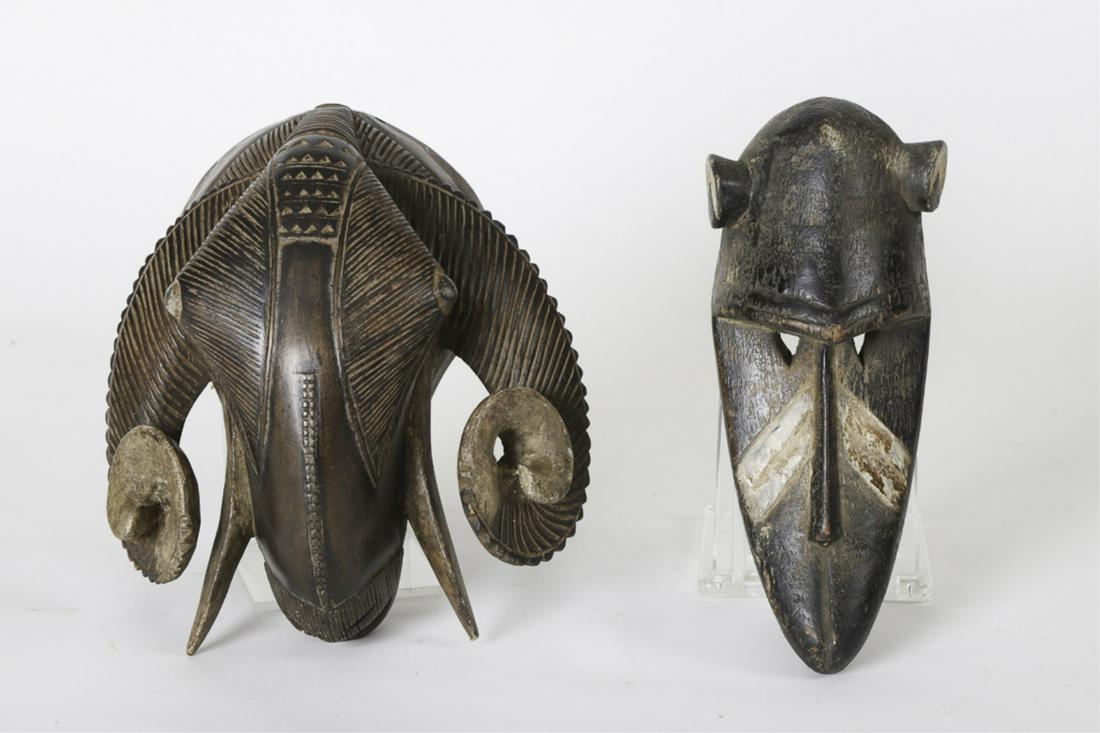 (2) WEST AFRICAN / PROBABLY GURO ANIMAL MASKS: (mid 20th c) (1) Representing an ox, the other a monkey. 11 1/2 inches (and under)