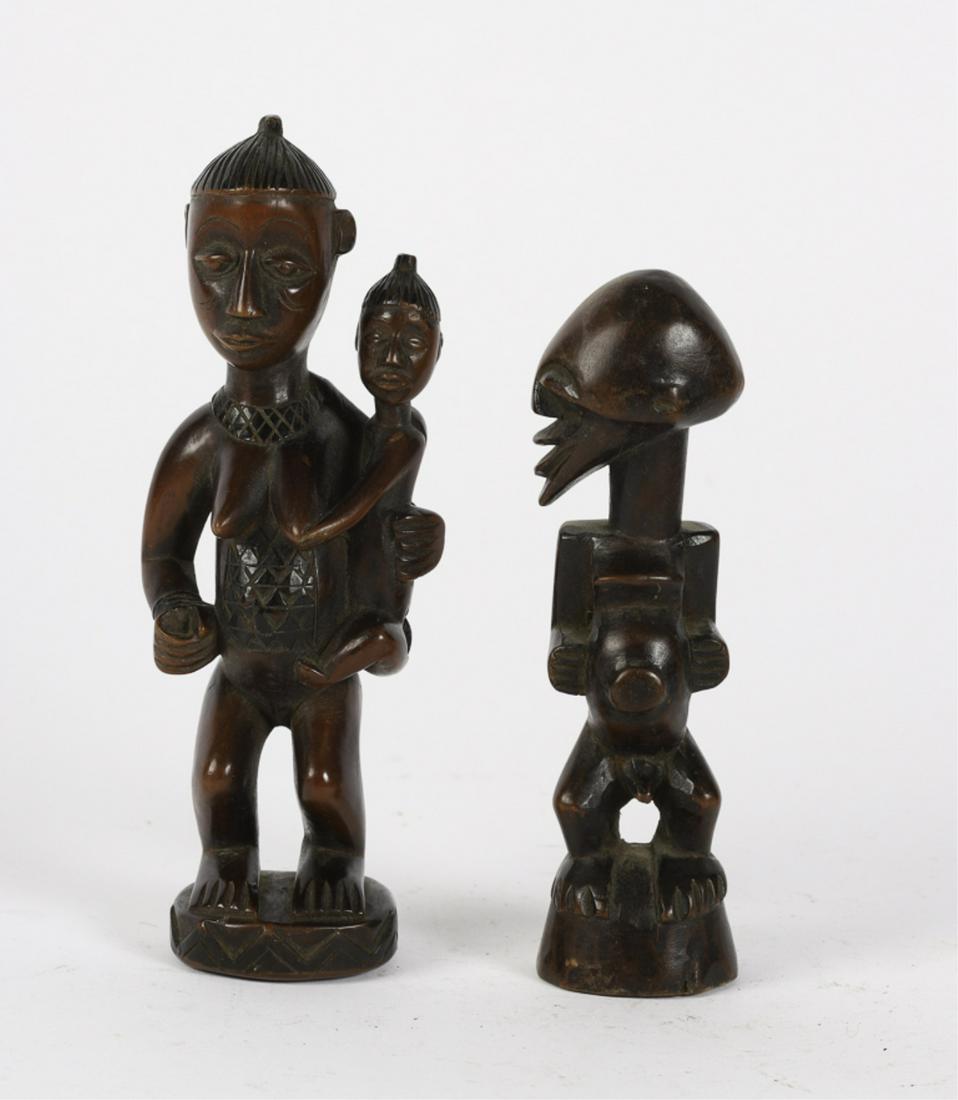 (2) WELL CARVED WEST AFRICAN FIGURES: Including: Effigy deity and a maternity figure of a mother and child with belly scarification. 8 3/4 inches (and under)