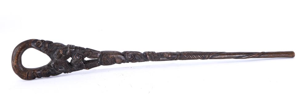 (Early 20th c) PACIFIC ISLANDS WALKING STICK: Highly decorated with geometric engraved designs. Previously decorated with abalone shells for the eyes. 37 1/2 inches