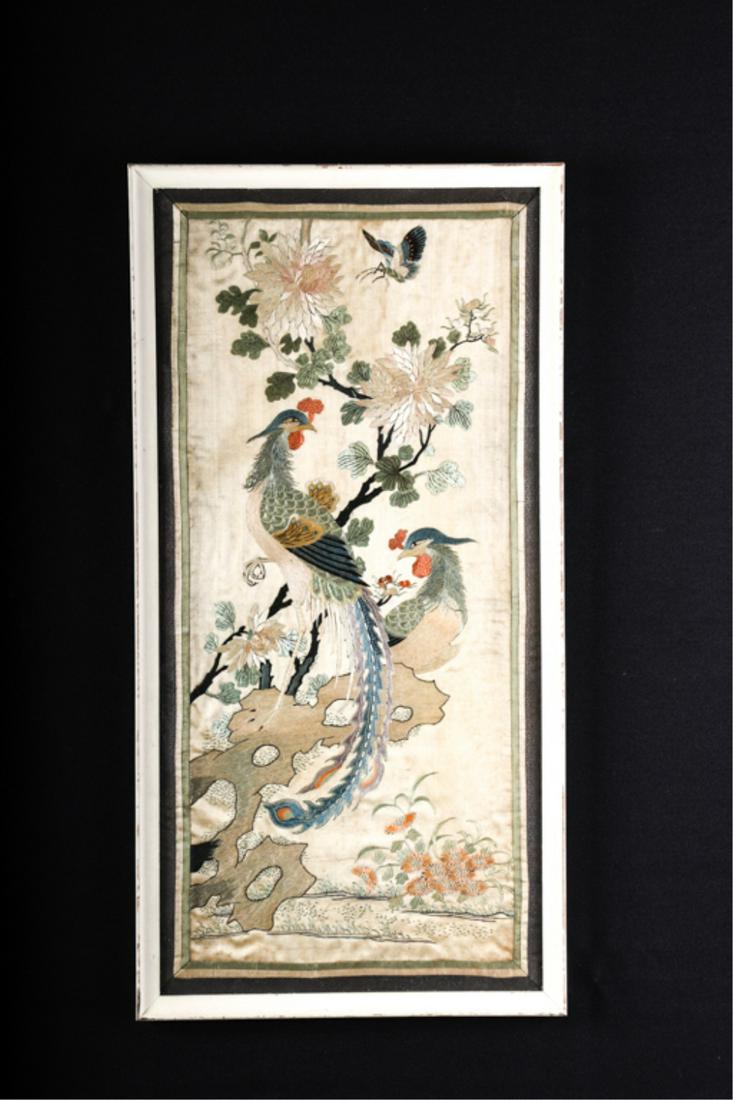 CHINESE SILK EMBROIDED PANEL: Pea fowl and butterfly within a landscape of flora and flowering tree. silk on silk. 26 x 12 1/2 inches. framed 28 x 14 inches (overall)