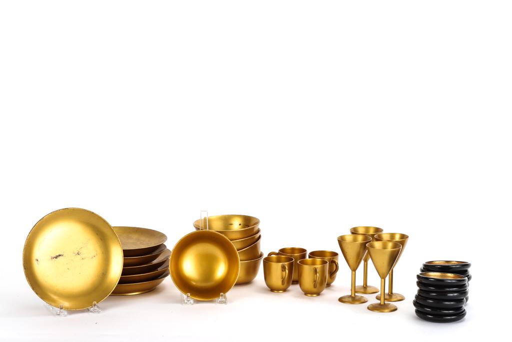 JAPANESE GOLD LACQUERWARE: Including: (5) Bowls 4 3/4 inches, (6) plates 6 3/4 inches, (4) wines, (4) teacups and (12) coasters. unmarked