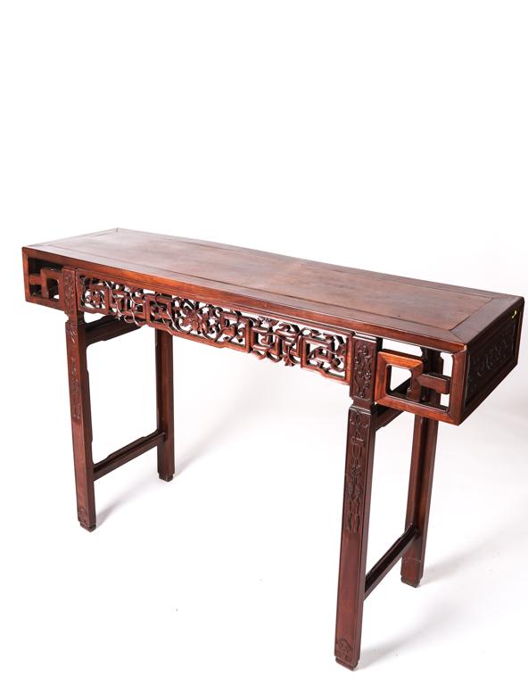 CHINESE CARVED ROSEWOOD CONSOLE TABLE: Carved and pieced with bats, fish, florets and pieced geometric diaper patterns. 36 1/2 x 56 1/2 x 16 1/4 inches.