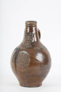 Small Bellarmine Bartmann Bearded Man Jug: Molasses glazed stoneware. 9 inches
