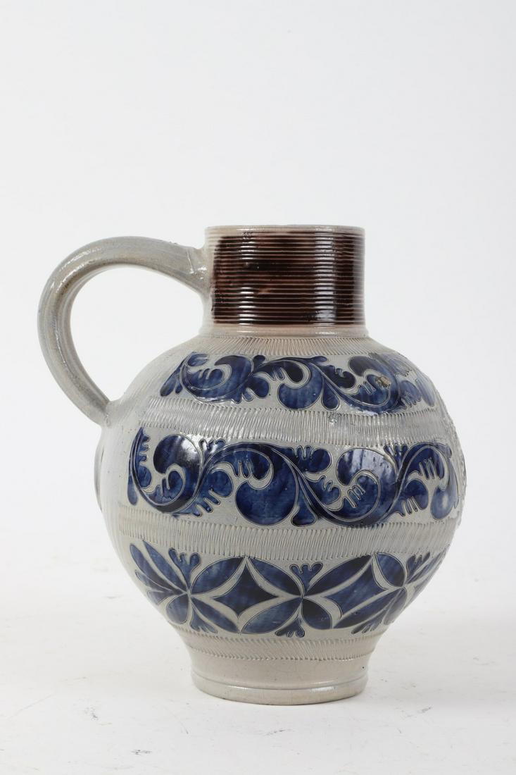 (18th c) Westerwald Salt Glazed Stoneware Jug: “GR” inscribed with traditional threading and scrolls highlighted with cobalt. 10 ½ inches