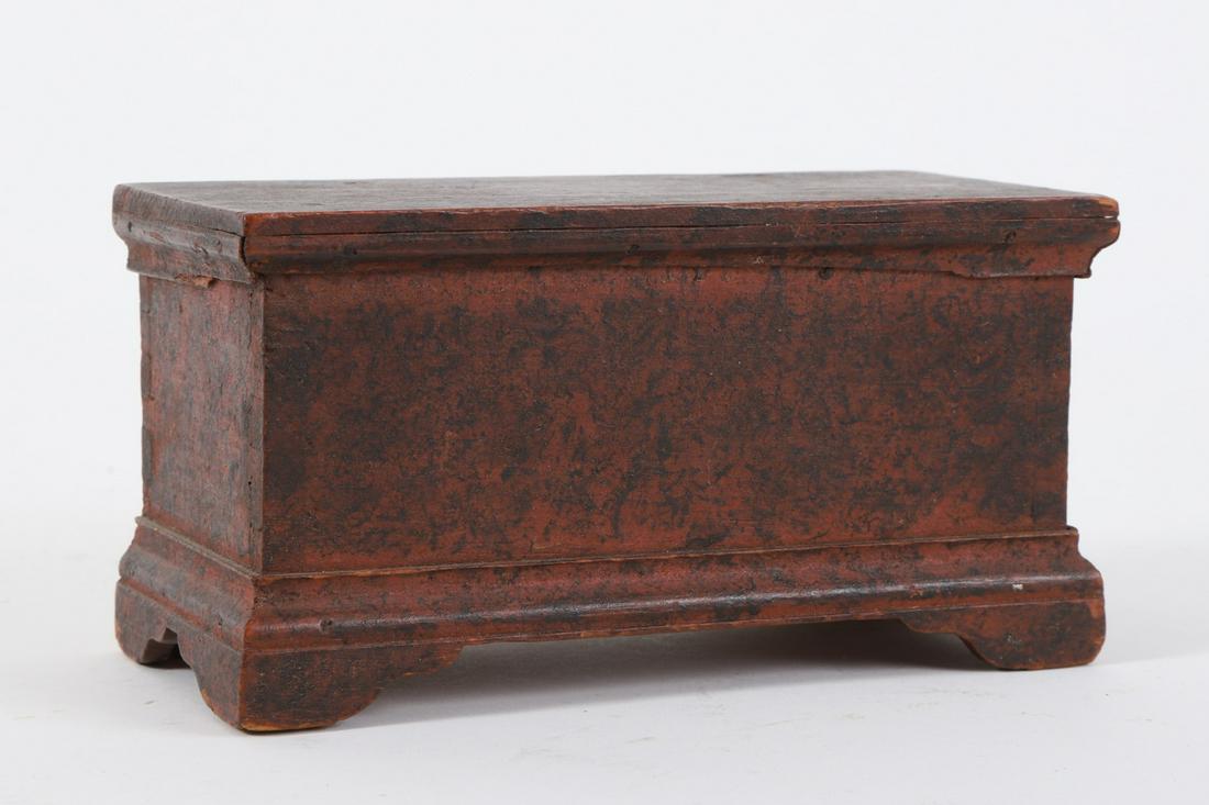 Miniature Chippendale Chest with Snipe Hinges: Sponge decorated pine with molded and bracket base. 3 ½ x 6 ½ x 3 inches