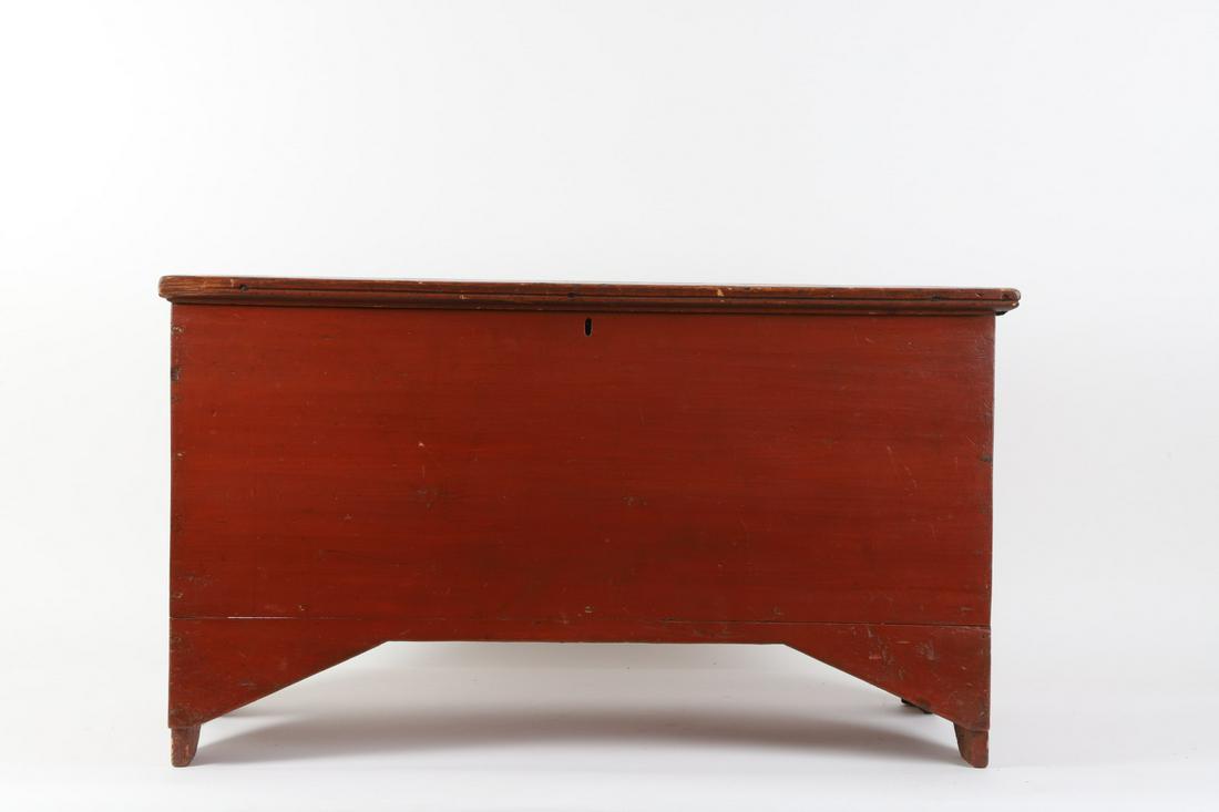 (19th c) Diminutive Six Board Chest in Red Paint: Bread board top and boot jack ends with a shaped apron. 21 x 36 x 16 inches