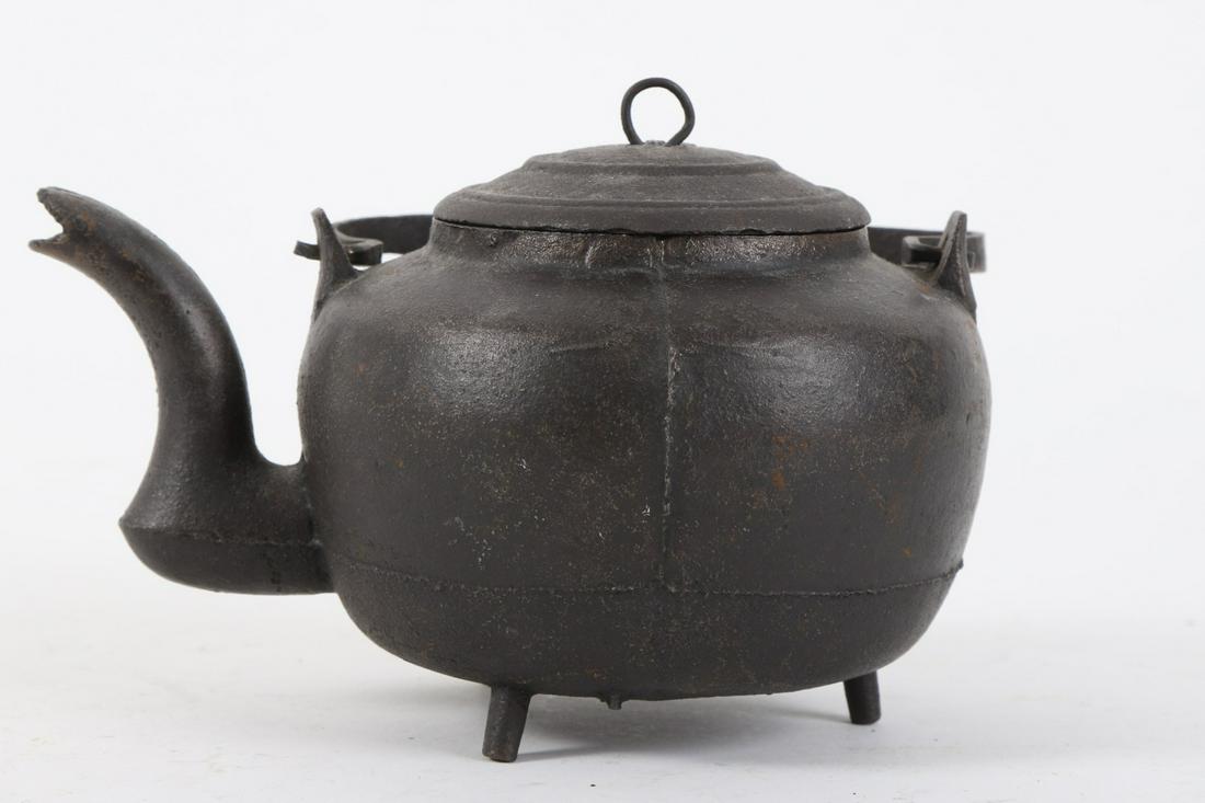Miniature Cast Iron Swing Handle Kettle: Pronounced spout. 4 x 7 inches.