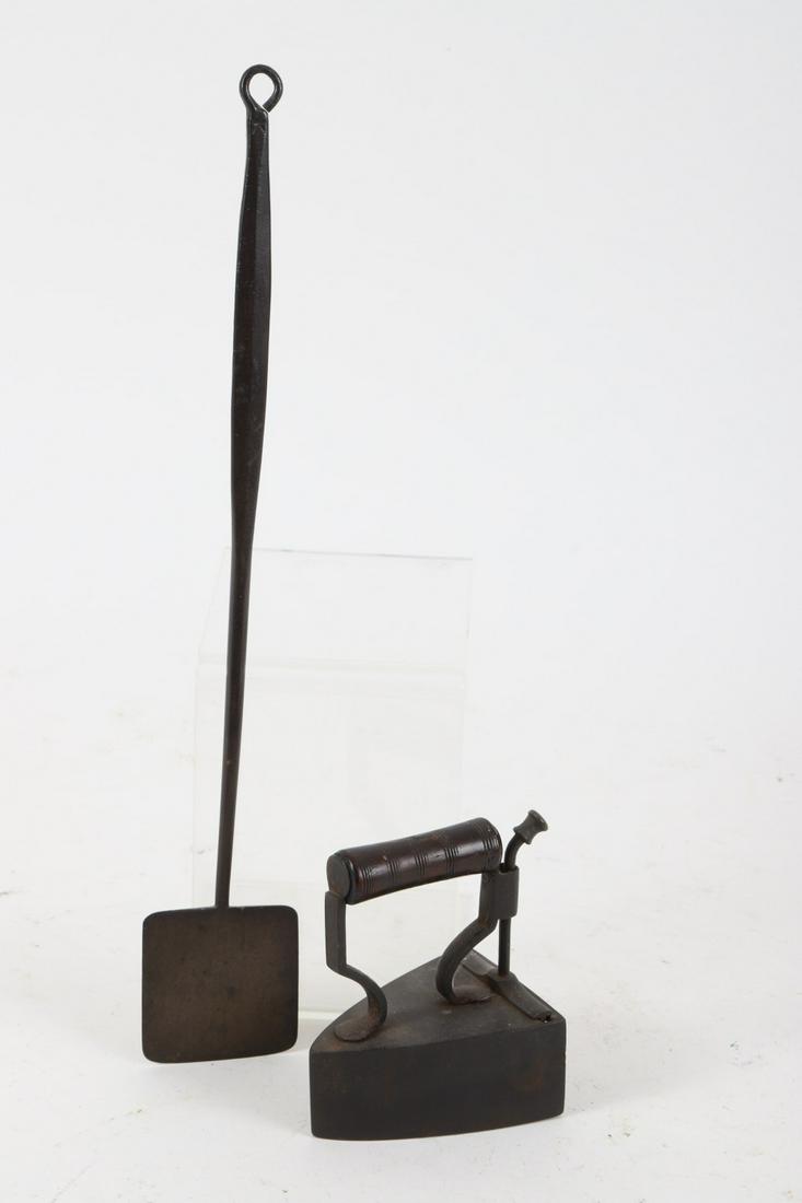 Finely Wrought Lace Iron & Mini Peel: Turned hardwood handle, sliding door for iron slug. 4 ½ x 2 ¾ inches. Together with a miniature wrought iron peel 15 inches