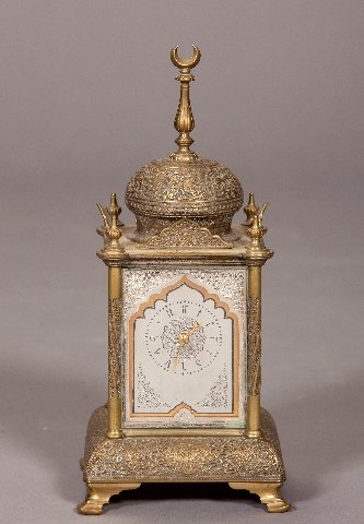 Elaborate French carriage clock with a Middle East: Elaborate French carriage clock with a Middle Eastern designed case with silver gilt highlights. Height: 11 1/2 in.