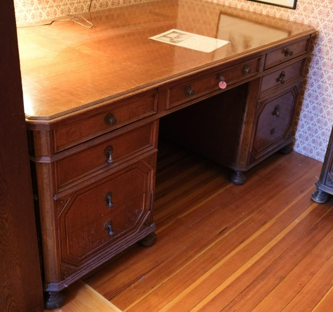 EXECUTIVE QUALITY WALNUT BANDED (2) BANK DESK: Clipped corners with graduating molded drawers raised on bun feet. 30 1/2 x 70 x 37 1/2 inches. Note: See lot 7329 which matches this desk