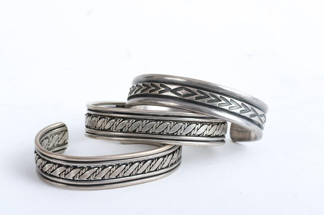 (3) NATIVE AMERICAN NAVAJO SILVER BRACELETS: (2) Pierced chain and (1) chevron examples. 2 1/4 x 2 inches (approx each) 3.29 troy ounces