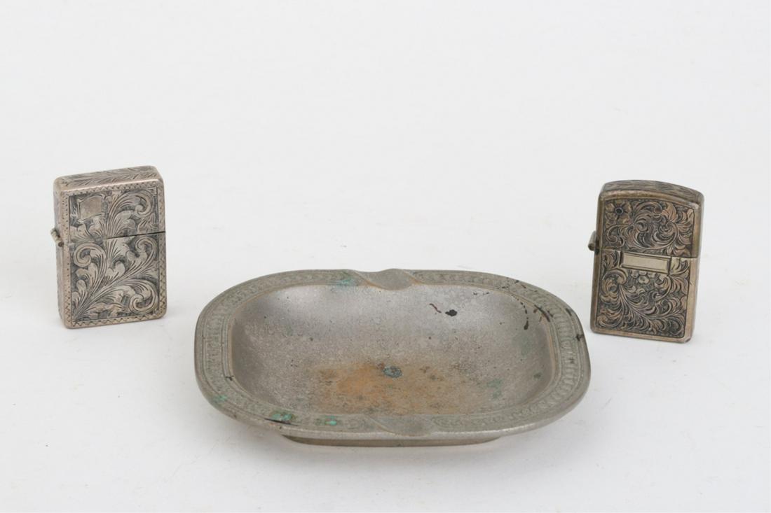 TIFFANY STUDIOS ASH TRAY SILVER LIGHTER & MATCHBOX: Tray numbered 2079, Finely engraved matchbox is unmarked lighter case is marked Made in Italy. 4 3/4 x 5 1/4 inches (and under)