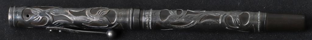 WATERMAN'S IDEAL FOUNTAIN PEN: Pierced sterling silver overlay in a period art nouveau motif. Signed on nib.