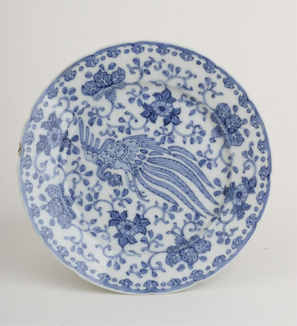 CHINESE PORCELAIN BLUE & WHITE PLATE SIGNED: Lobed rim and decorated with a peafowl amidst a repeating floral pattern. signed 7 1/4 inches