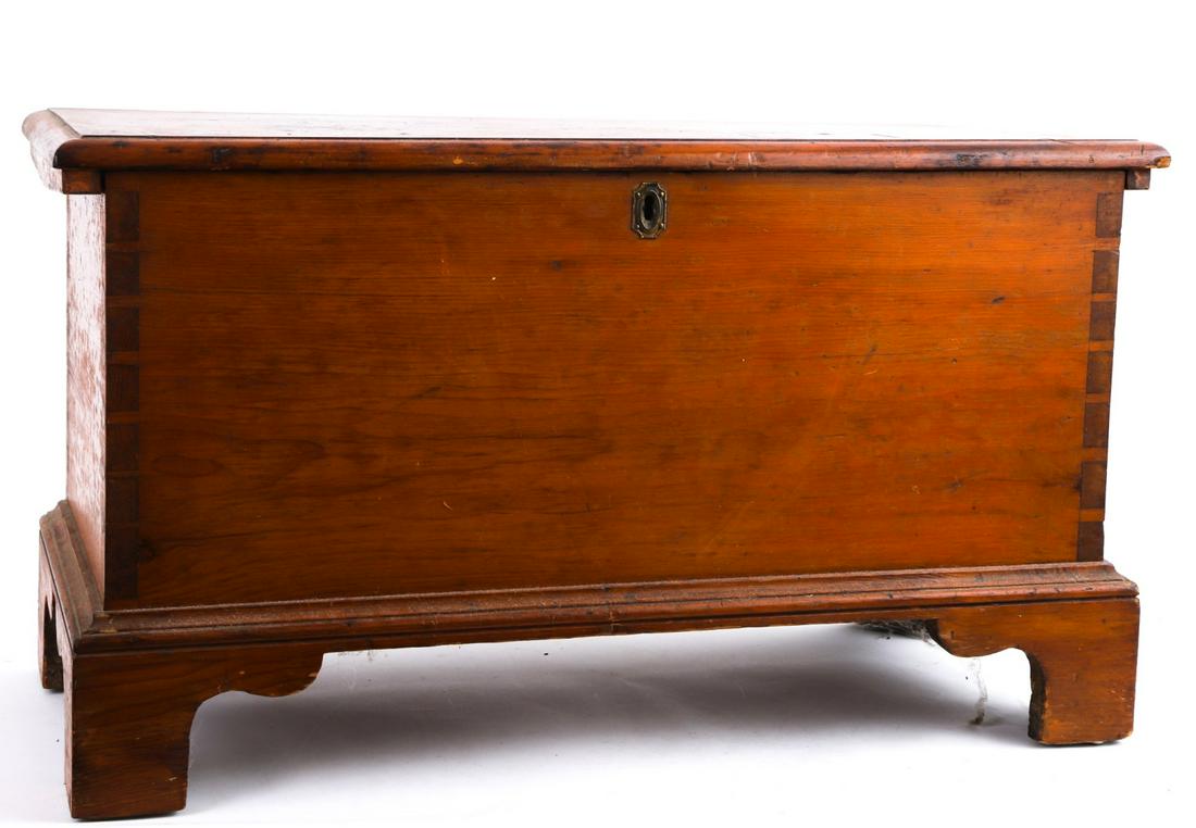 (18th / 19th c) PINE DOVETAILED CHEST: Molded top opens to till. Base is also molded and raised on bracket feet. 18 1/2 x 33 x 14 1/2 inches.
