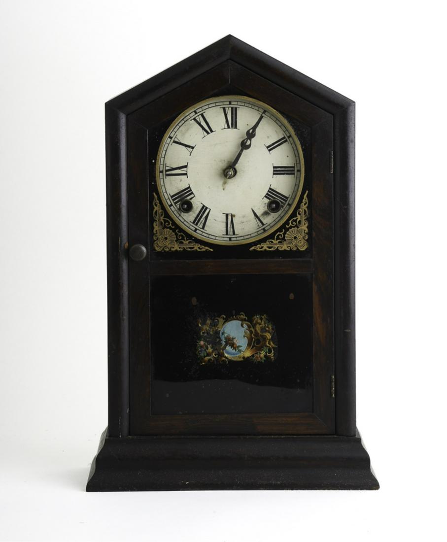 ATKINS CLOCK COMPANY MANTLE CLOCK: 5 inch dial with chiming pendulum movement. 15 1/2 inches.