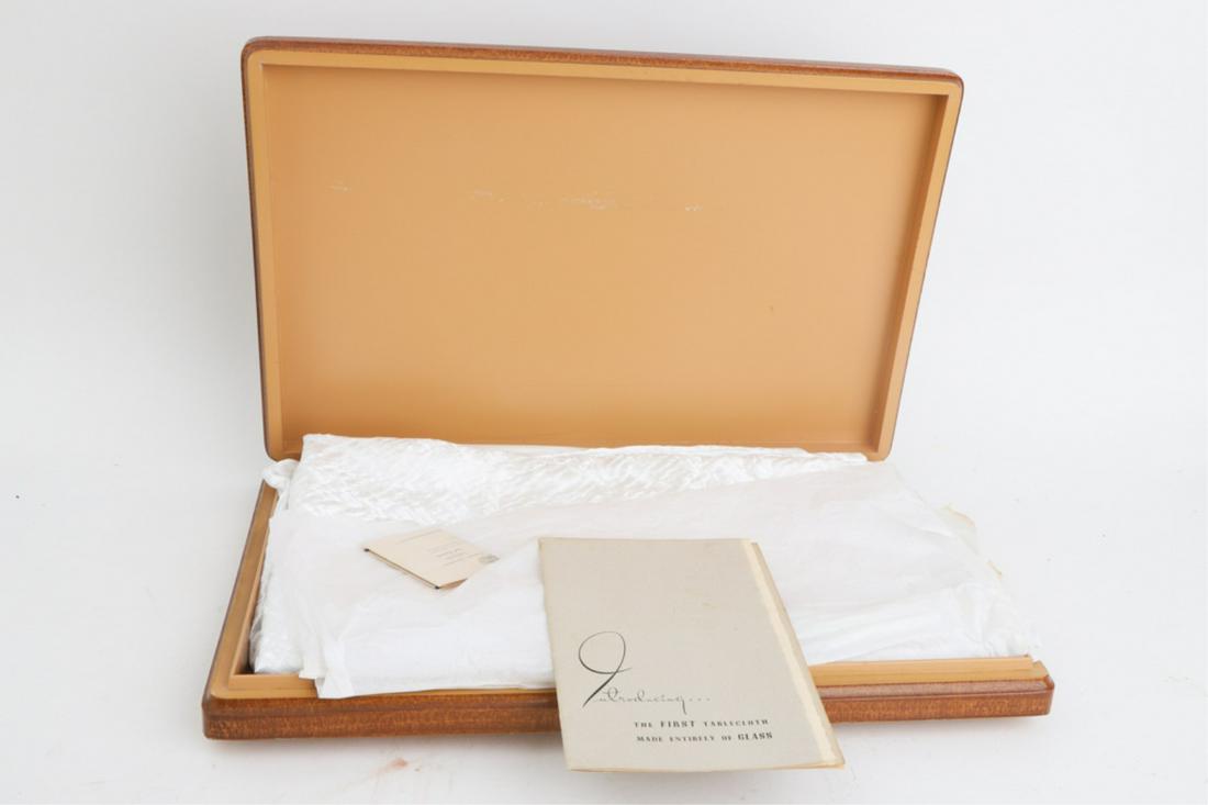 MID CENTURY MODERN FIRST FIBERGLAS TABLECLOTH: Amazing sheen. No. 49 of a "First Edition" of 500. Custom-woven for Alfred C. Howell. 72 x 84 inches (rectangular). Together with its original pamphlet, laundry instructions and case. 2 x 20 1/2 x 13 