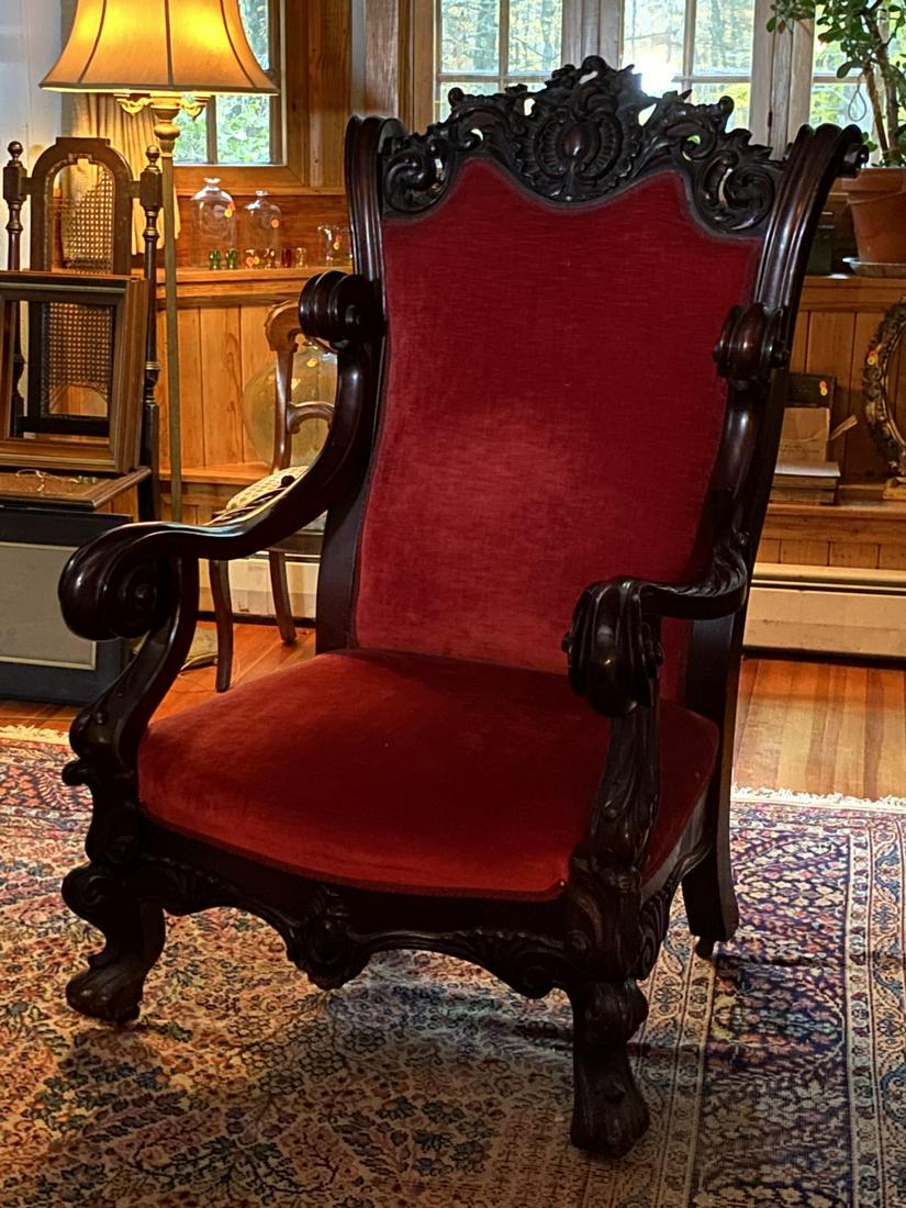 (19th c) CHIPPENDALE ROCOCO GREAT CHAIR: Massive and deeply carved mahogany upholstered armchair with acanthus leafs, scrolls, ruffles and lion paw feet. 53 x 33 x 32 inches.