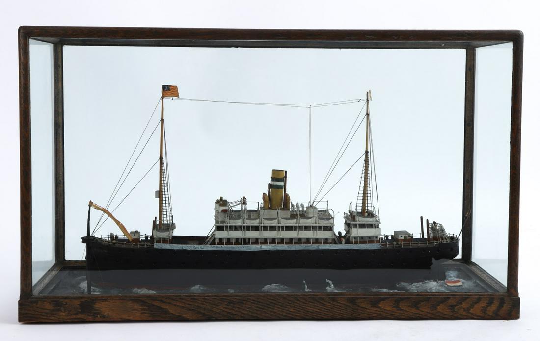CASE MODEL OF THE PASSINGER LINER RIJNDAM: Carved and painted wood and metal. 15 1/2 x 27 x 9 inches (case)