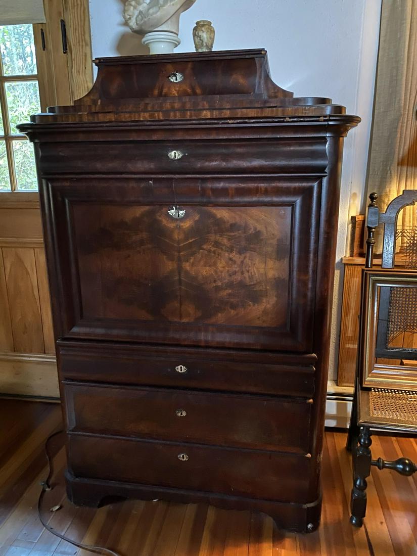 BIEDEMEIER FALL FRONT WALNUT SECRETARY: Surmounted by a locking drawer on (2) steps, molded case starts with upper drawer over a fall front door which opens to a flame birch and walnut Dutch-ripple interior.. (11) drawers and center cabinet