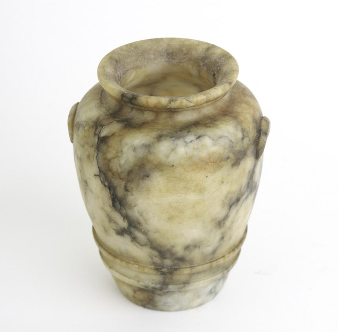 SMALL NICELY GRAINED ALABASTER VASE: Rolled rim, looped handles and ringed base. 3 1/2 inches.