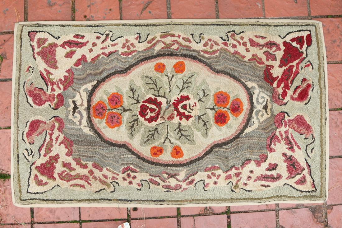HOOKED RUG with ROSES within CARTOUCHE & BORDER: 30 x 52 inches